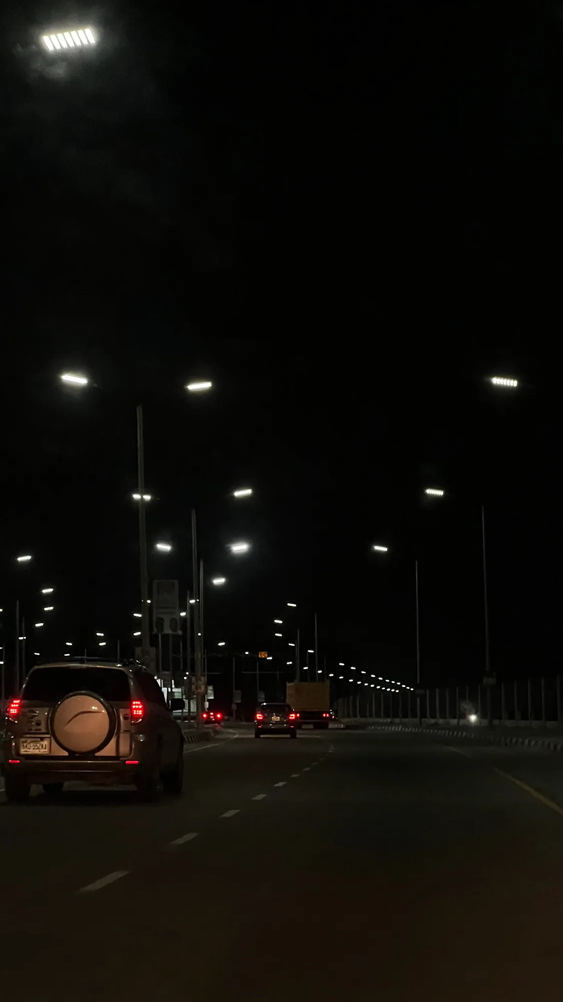 Street lights along Coastal Road at night