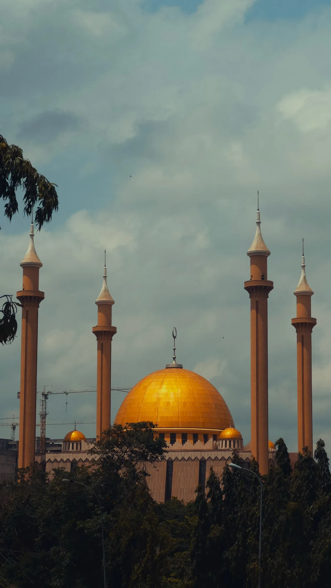 The golden dome and minarets of the National Mosque, Abuja